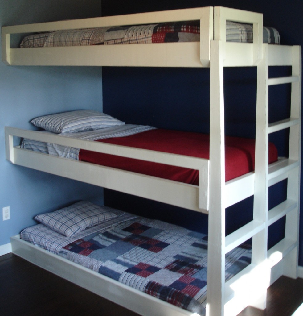 three bunk beds in one room